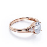 Tapered Shank 7 Stone 1.35 Carat Oval Cut Moissanite and Diamond Prong Basket Engagement Ring in White Gold