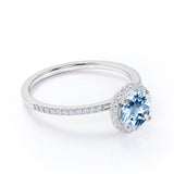 1.50 Carat Round cut Aquamarine and Diamond Halo Engagement Ring in Rose Gold