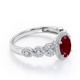 Twisted 1.45 Carat Oval Cut Lab Ruby And Diamond Halo Engagement Ring In White Gold