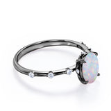 Sharp Four Claws 1.10 Carat Oval Cut Fire Opal And Diamond Seven Stone Engagement Ring In White Gold