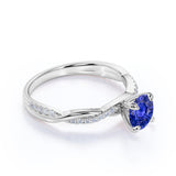 Infinity Style 1.25 Carat Round Cut Sapphire and Diamond Engagement Ring in White Gold