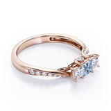 Scale Bridge Accent 0.65 carat Princess Aquamarine and Moissanite Twisted Wave Engagement Ring in Rose Gold