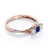 Scale Bridge Accent 0.65 carat Princess Blue Sapphire and Moissanite Twisted Wave Engagement Ring in Rose Gold