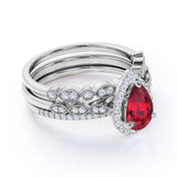 Classic Pave 2.50 Carat Pear Shape Lab Ruby and Diamond Halo Trio Bridal Set with Art Deco Bands in White Gold