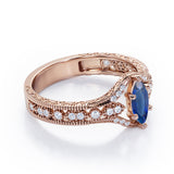 Beaded Framed 1.25 Carat Marquise Cut Sapphire And Diamond Vintage Filigree Engagement Ring In Rose Gold