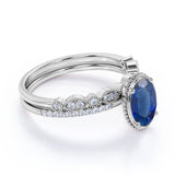 Vintage Bezel Set 1.50 Carat Oval Cut Sapphire and Diamond Art Deco Wedding Ring Set in White Gold