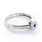 Clustered 1 carat Round Petite Blue Sapphire and Moissanites Channel Engagement Ring in White Gold