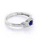 Trellis Three Stones 1 carat Princess Blue Sapphire and Moissanites Braided Engagement Ring in White Gold