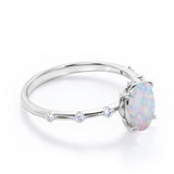 Sharp Four Claws 1.10 Carat Oval Cut Fire Opal And Diamond Seven Stone Engagement Ring In White Gold