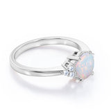 Seven Stone 1.25 Carat Round Cut Natural Opal And Diamond Tapered Engagement Ring In White Gold.