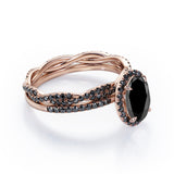 Four-Prong Halo 1.75 TCW Oval-Shaped Lab Created Black Diamond Pave Twisted Eternity Bridal Set in White Gold