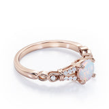 Split Shank 0.6 carat Round Opal and Diamond Engagement Ring in Rose Gold
