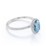 1.25 Carat oval cut Aquamarine and Diamond Halo Wedding Ring in Rose Gold