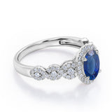 Twisted 1.45 Carat Oval Cut Sapphire And Diamond Halo Engagement Ring In White Gold