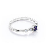 Classic Six Prong 1.10 Carat Round Cut Lab Created Alexandrite And Diamond Five Stone Engagement Ring In White Gold.