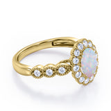 Vintage Floral Halo 0.7 carat Oval and Round Opal and diamond Engagement Ring in Rose Gold