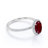 Antique Design 1.50 Carat Oval Cut Lab Ruby and Diamond Halo Engagement Ring in White Gold