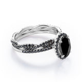 Four-Prong Halo 1.75 TCW Oval-Shaped Lab Created Black Diamond Pave Twisted Eternity Bridal Set in White Gold