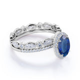 Eternity Micro Pave 2 Carat Oval Cut Sapphire and Diamond Halo Bridal Set in White Gold