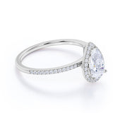 1.50 Carat Pear Cut Moissanite and Diamond Halo Engagement Ring in White Gold