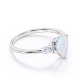 Affordable 1.35 Carat Tear Drop White Opal And Diamond  Seven Stone Engagement Ring In White Gold.