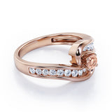Spinning 0.7 carat Round Morganite and Moissanite Channel Engagement Ring in Rose Gold