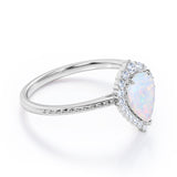 Vintage Inspired 1.35 Carat Tear Drop Fiery White Opal And Diamond Halo Engagement Ring In White Gold