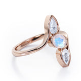 Distorted Line Three Stone 1 carat Oval and Pear Moonstone and moissanite Ring in Rose Gold