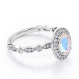 Antique Art Deco 1.35 Carat Oval Cut Moonstone And Diamond Halo Engagement Ring In White Gold