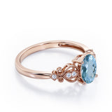 Swirly 0.5 carat Oval Aquamarine and Diamonds Antique Engagement Ring in Rose Gold