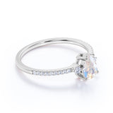 Surface Prong Set 1.50 Carat Pear White Blue Moonstone and Diamond Engagement Ring in Rose Gold