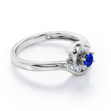 Whirly Gemstone 0.55 carat Round Blue Sapphire and Moissanites Artistic Engagement Ring in White Gold