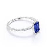 Stunning Bezel Set 1.25 Carat Emerald Cut Sapphire and Diamond Micro Pave Engagement Ring in White Gold