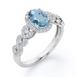 Twisted 1.45 Carat Oval Cut Aquamarine And Diamond Halo Engagement Ring In White Gold