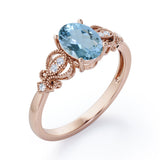 Swirly 0.5 carat Oval Aquamarine and Diamonds Antique Engagement Ring in Rose Gold
