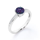 Simple Four Prong 1.25 Carat Round Cut Lab Created Alexandrite And Diamond Channel Set Engagement Ring In White Gold