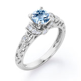 Unique Four Prong 1.15 Carat Round Cut Aquamarine And Diamond Art Deco Engagement Ring In White Gold