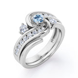 Twisted Tension - Prong 1 TCW Round Brilliant Cut Aquamarine and Moissanite - Flush Channel Wedding Set in White Gold