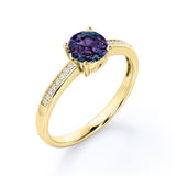 Simple Four Prong 1.25 Carat Round Cut Lab Created Alexandrite And Diamond Channel Set Engagement Ring In White Gold