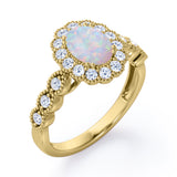 Vintage Floral Halo 0.7 carat Oval and Round Opal and diamond Engagement Ring in Rose Gold