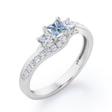 Trellis Three Stones 1 carat Princess Aquamarine and Moissanites Braided Engagement Ring in Rose Gold
