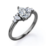 Fashionable 7 Stones 0.6 carat Pear Moissanite and Diamond Engagement Ring in Rose Gold