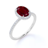 Antique Design 1.50 Carat Oval Cut Lab Ruby and Diamond Halo Engagement Ring in White Gold