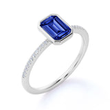 Stunning Bezel Set 1.25 Carat Emerald Cut Sapphire and Diamond Micro Pave Engagement Ring in White Gold