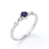 Classic Six Prong 1.10 Carat Round Cut Lab Created Alexandrite And Diamond Five Stone Engagement Ring In White Gold.