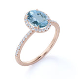 1.25 Carat oval cut Aquamarine and Diamond Halo Wedding Ring in Rose Gold