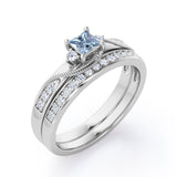 Trilogy Duo Milgrain 0.7 TCW Princess Cut Aquamarine and Moissanite Vintage Bridal Ring Set in White Gold