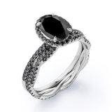 Four-Prong Halo 1.75 TCW Oval-Shaped Lab Created Black Diamond Pave Twisted Eternity Bridal Set in White Gold