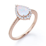 Vintage Inspired 1.35 Carat Tear Drop Fiery White Opal And Diamond Halo Engagement Ring In White Gold