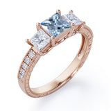 Trilogy 1.25 Carat Princess Cut Aquamarine And Diamond Three Stone Vintage Milgrain Engagement Ring In Rose Gold